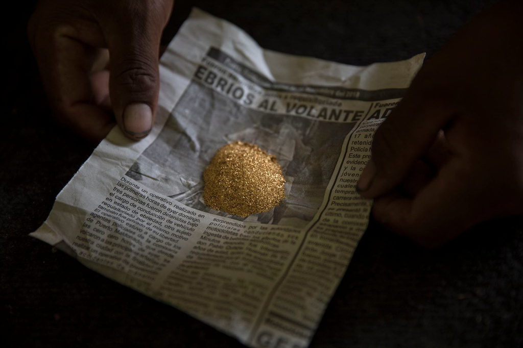FILE - Gold collected after a day of work is ready to be weighed at a mining camp in Madre de Dios, Peru, April 5, 2019. (AP Photo/Rodrigo Abd, File)