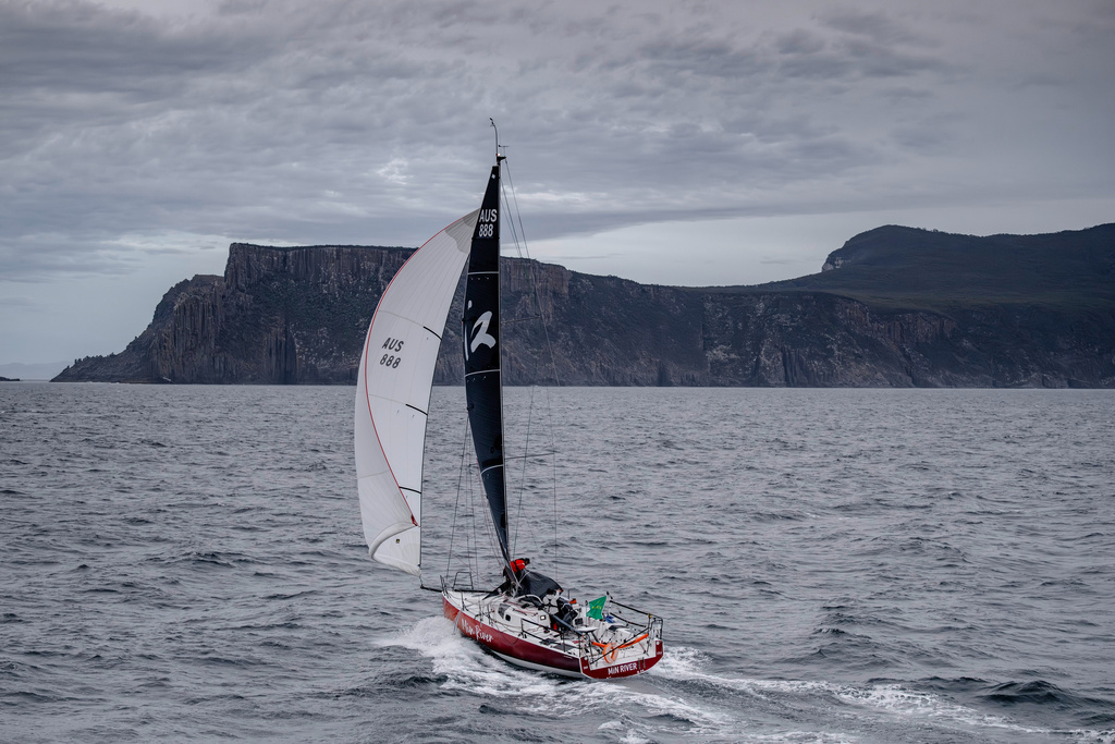 In this photo provided by the Cruising Yacht Club of Australia, the boat Min River is sailed by Jiang Lin and Alexis Loison near Hobart, Australia, Tuesday, Dec. 30, 2025, as they finish the Sydney Hobart yacht race. (Kurt Arrigo/CYCA via AP)