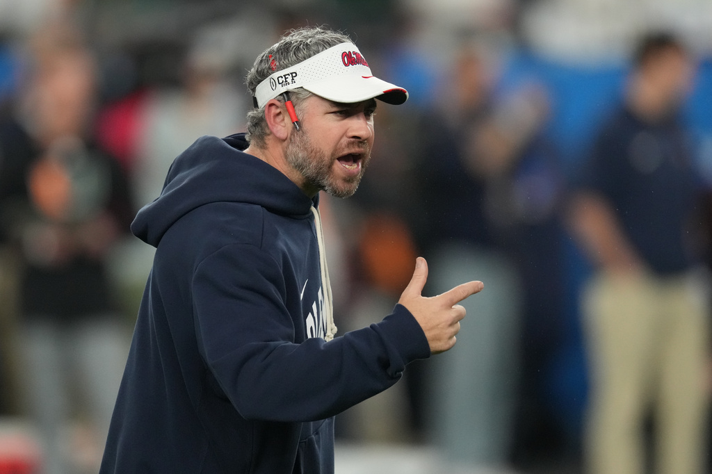 Mississippi head coach Pete Golding directs his players before the Fiesta Bowl NCAA college football playoff semifinal game against Miami, Thursday, Jan. 8, 2026, in Glendale, Ariz. (AP Photo/Ross D. Franklin)