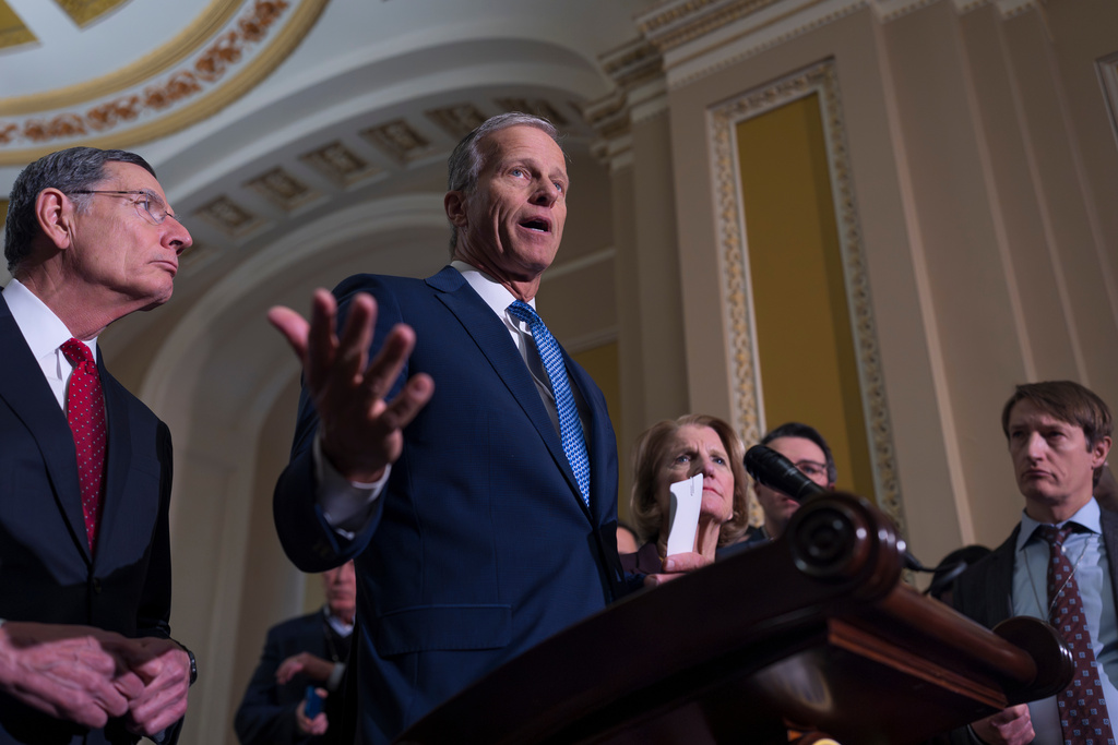 Senate Majority Leader John Thune, R-S.D., center, joined at left by Sen. John Barrasso, R-Wyo., the GOP whip, speaks to reporters following a closed-door GOP strategy session, at the Capitol in Washington, Tuesday, Feb. 3, 2026. (AP Photo/J. Scott Applewhite)