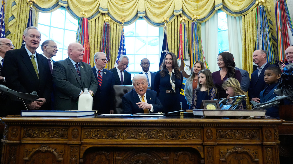 President Donald Trump speaks in the Oval Office of the White House, Wednesday, Jan. 14, 2026, in Washington, before signing a bill that returns whole milk to school cafeterias across the country.. (AP Photo/Alex Brandon)
