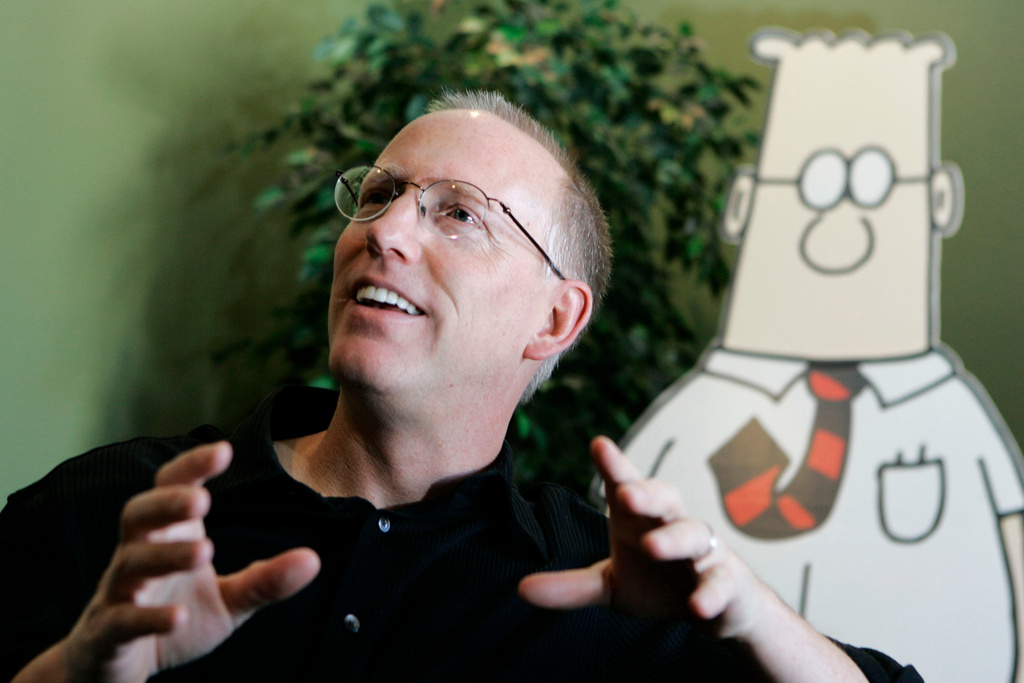 FILE - Scott Adams, creator of the comic strip Dilbert, talks about his work at his studio in Dublin, Calif., on Oct. 26, 2006. (AP Photo/Marcio Jose Sanchez, File)