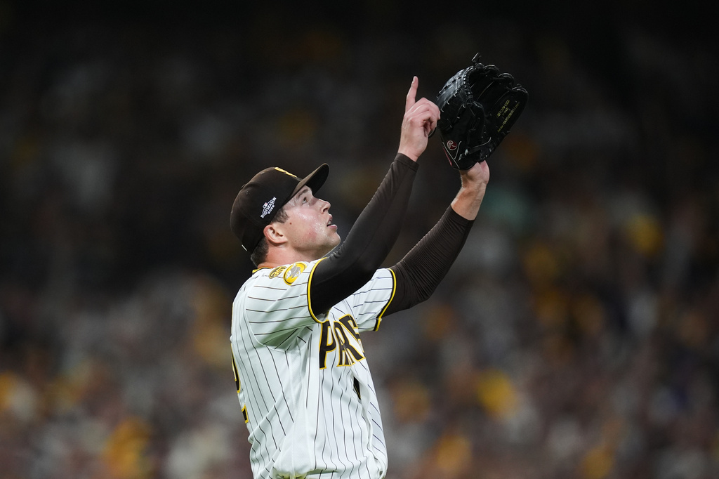 San Diego Padres pitcher Mason Miller reacts after defeating the Chicago Cubs in Game 2 of the National League Wild Card baseball playoff series Wednesday, Sept. 30, 2026, in San Diego. (AP Photo/Gregory Bull)