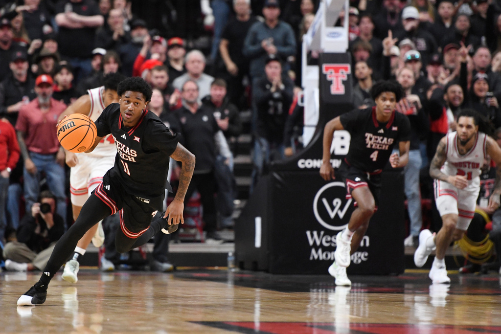 Texas Tech guard Jaylen Petty (11) dribbles the ball during the first half in an NCAA college basketball game against Houston, Saturday, Jan. 24, 2026, in Lubbock, Texas. (AP Photo/Annie Rice)
