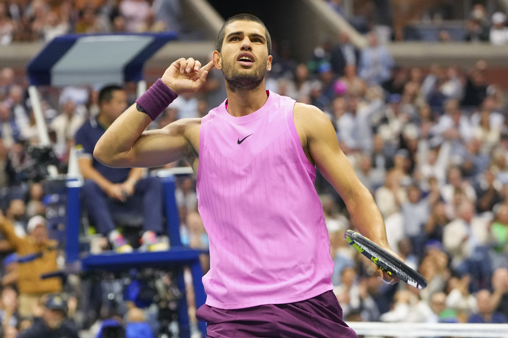 Carlos Alcaraz, of Spain, reacts after scoring a point against Jannik Sinner, of Italy, during the men's singles final of the U.S. Open tennis championships, Sunday, Sept. 7, 2025, in New York. (AP Photo/Kirsty Wigglesworth)