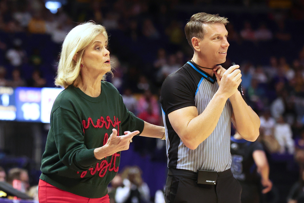 LSU head coach Kim Mulkey talks to a referee in the first half of an NCAA college basketball game between Texas-Arlington and LSU in Baton Rouge, La., Sunday, Dec. 21, 2025. (AP Photo/Peter Forest)