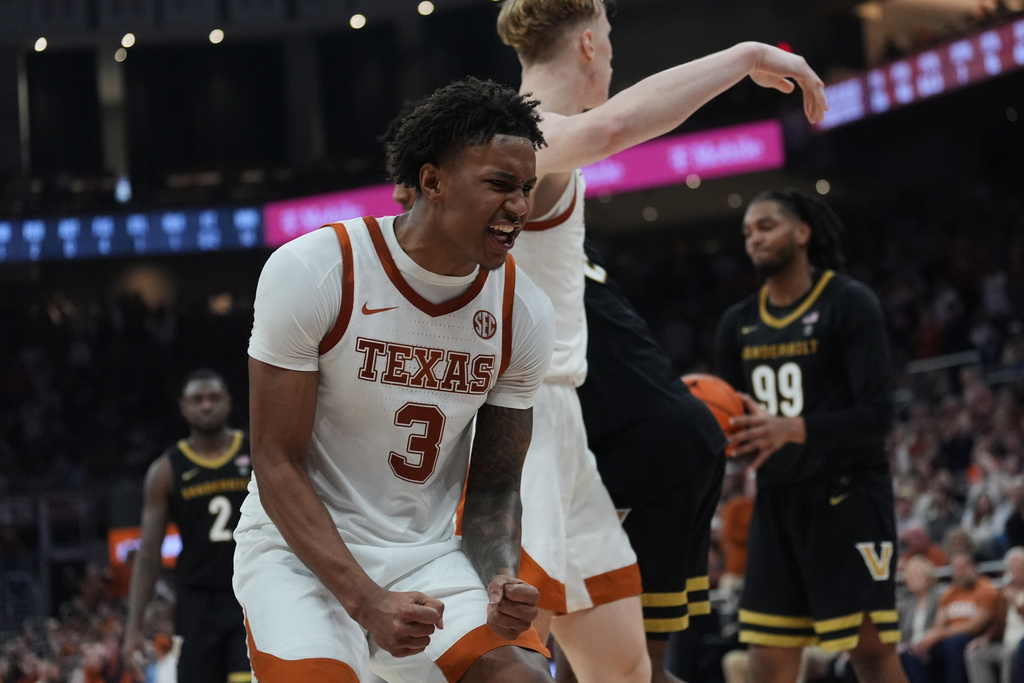 Texas guard Dailyn Swain (3) celebrates a play against Vanderbilt during the second half of an NCAA college basketball game in Austin, Texas, Wednesday, Jan. 14, 2026. (AP Photo/Eric Gay)
