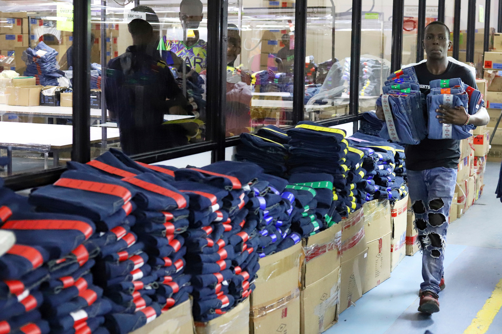 FILE - A factory worker arranges garments at United Aryan EPZ Limited in Ruaraka on the outskirts of Nairobi, Kenya, March 21, 2025. (AP Photo/Andrew Kasuku, File)