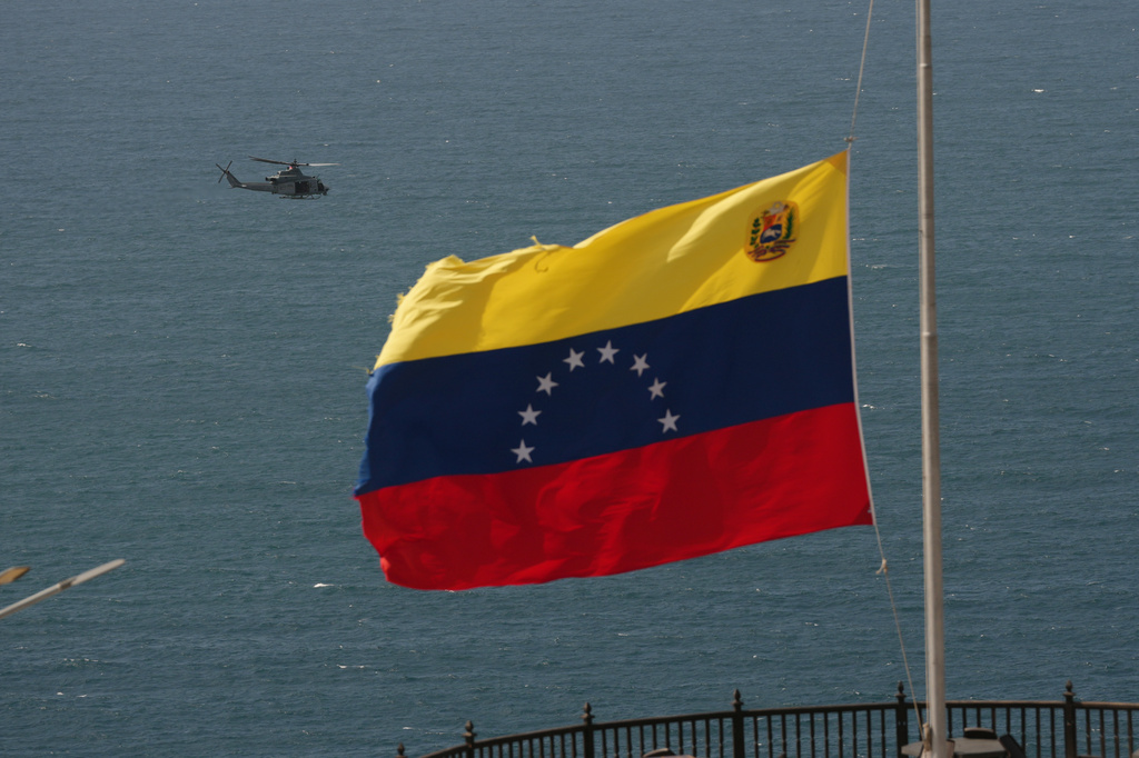 A helicopter takes off from a U.S. Navy ship docked at the seaport to support earthquake relief efforts in La Guaira, Venezuela, Monday, June 29, 2026. (AP Photo/Matias Delacroix)