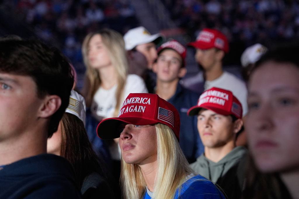 Attendees listen as Vice President JD Vance speaks during a "This Is the Turning Point" campus tour event at the University of Mississippi, in Oxford, Miss., Wednesday, Oct. 29, 2025. (AP Photo/Gerald Herbert)