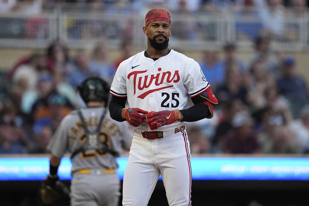 Minnesota Twins' Byron Buxton (25) stands at the plate after striking out to end the bottom of the third inning of a baseball game against the Athletics Tuesday, Aug. 19, 2025, in Minneapolis. (AP Photo/Abbie Parr)
