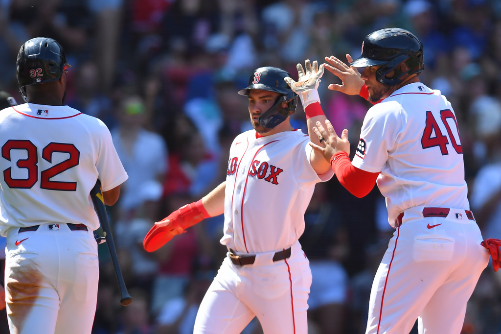 Boston Red Sox's Caleb Durbin, center, celebrates with Andruw Monasterio (32) and Willson Contreras (40) after he and Contreras scored on a two-run single by Jarren Duran in the fourth inning of a baseball game against the Toronto Blue Jays, Sunday, July 26, 2026, in Boston. (AP Photo/Steven Senne)