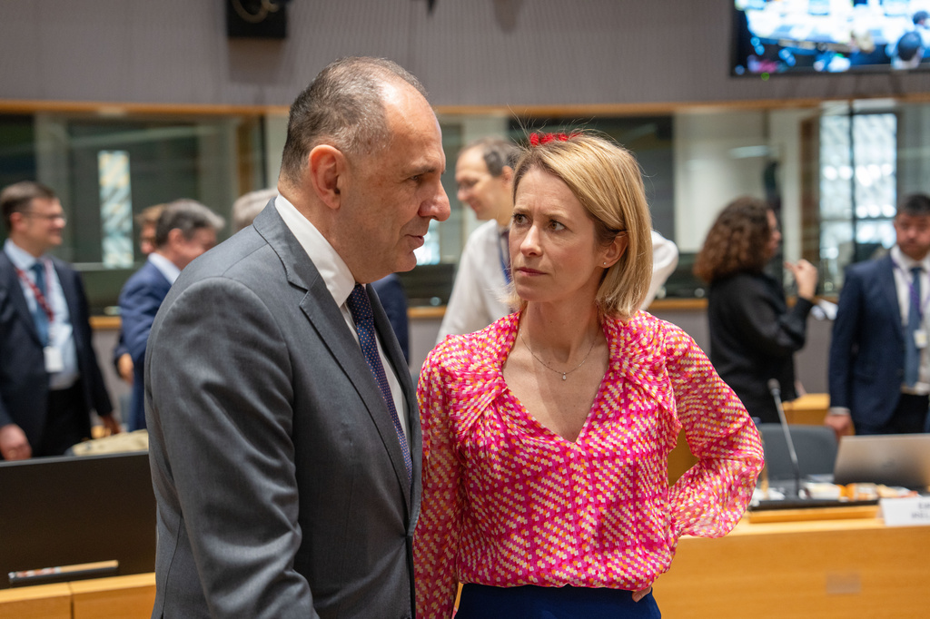 Greece's Foreign Minister Giorgos Gerapetritis, left, speaks with European Union foreign policy chief Kaja Kallas during a round table meeting of EU foreign ministers at the European Council building in Brussels, Monday, May 11, 2026. (AP Photo/Marius Burgelman)