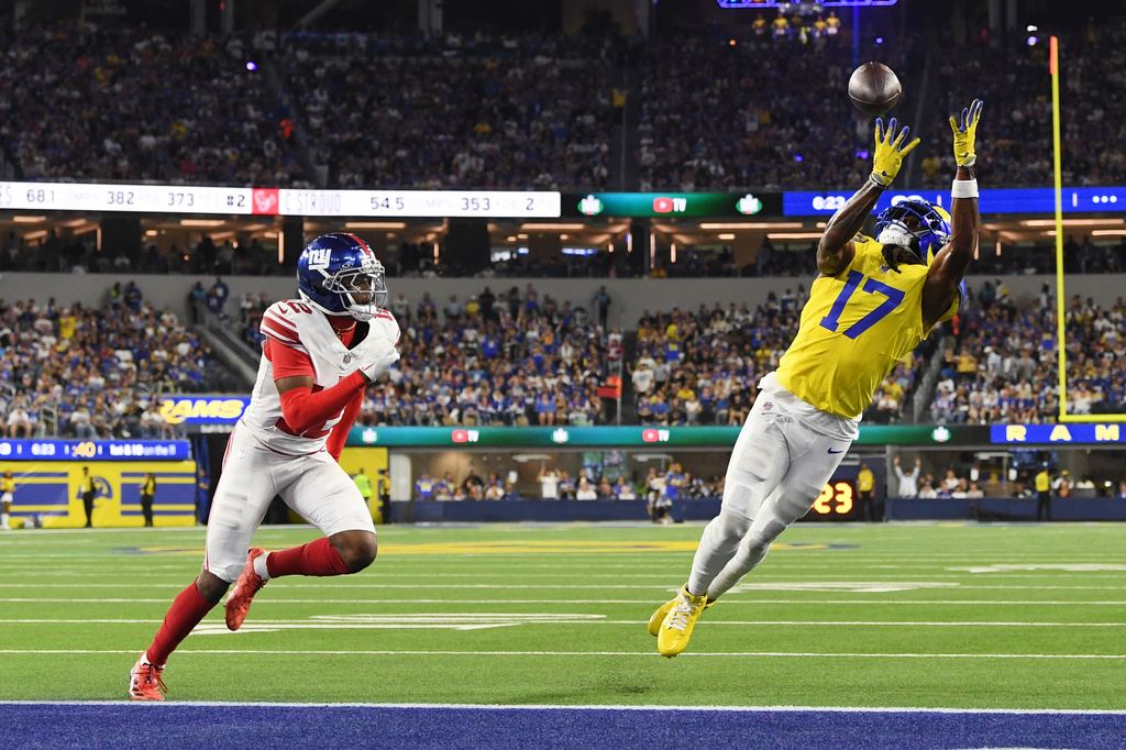 Los Angeles Rams wide receiver Davante Adams (17) makes a touchdown catch past New York Giants cornerback Colton Hood (12) during the second half of an NFL football game in Inglewood, Calif., Monday, Sept. 21, 2026. (AP Photo/Katie Chin)