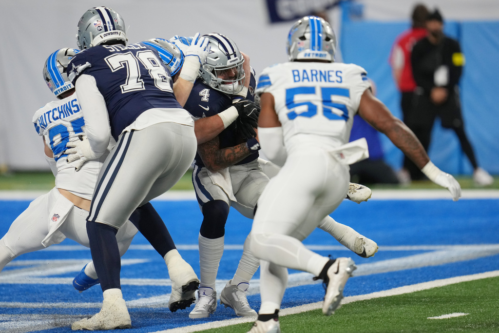 Dallas Cowboys quarterback Dak Prescott (4) is sacked by Detroit Lions linebacker Jack Campbell, not visible, during the first half of an NFL football game Thursday, Dec. 4, 2025, in Detroit. (AP Photo/Paul Sancya)