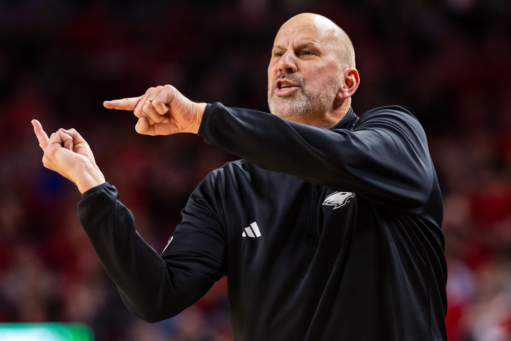 North Dakota head coach Paul Sather motions from the bench during the first half of an NCAA college basketball game against Nebraska, Sunday, Dec. 21, 2025, in Lincoln, Neb. (AP Photo/Bonnie Ryan)