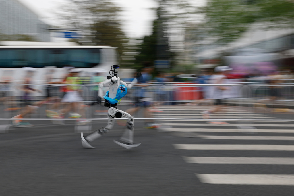 A humanoid robot runs in the second Beijing E-Town Half Marathon and Humanoid Robot Half Marathon in Beijing Sunday, April 19, 2026. (Haruna Furuhashi/Pool Photo via AP)