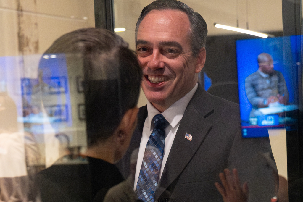 Public Service Commission candidate Peter Hubbard talks with Connie Di Cicco, political director for Georgia Conservation Voters, after arriving at their election night party in Southwest Atlanta, Tuesday, Nov. 4, 2025. (Ben Gray/Atlanta Journal-Constitution via AP)
