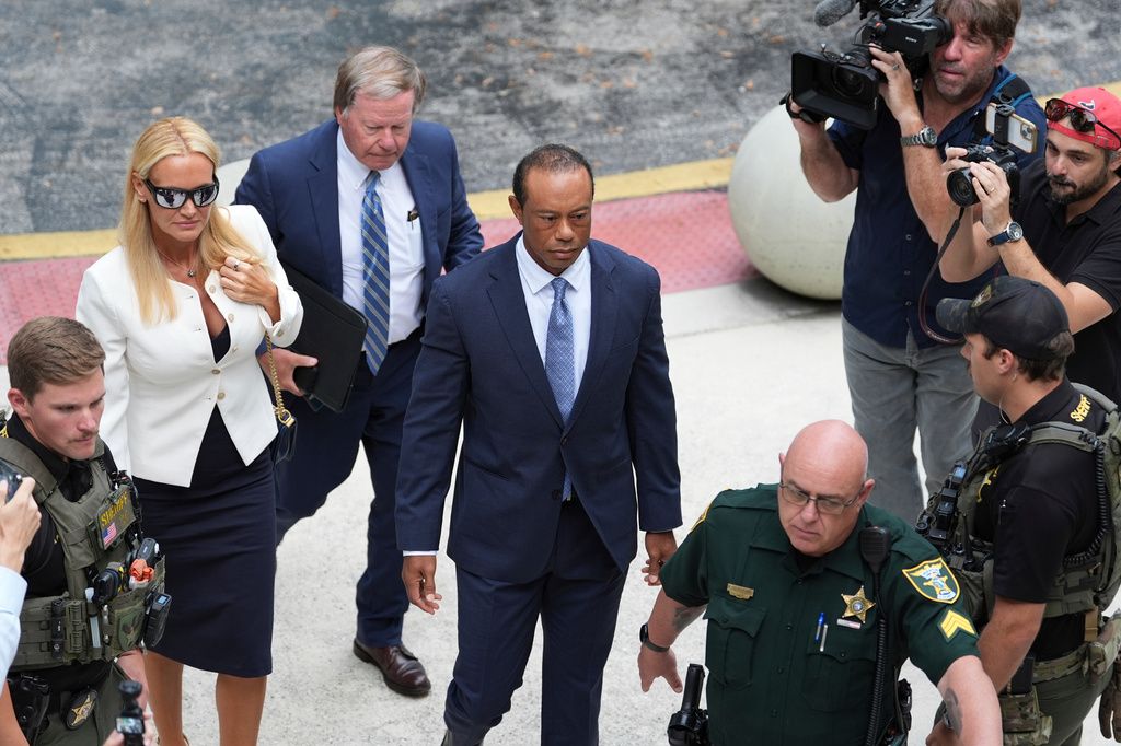 Golfer Tiger Woods, right, arrives with Vanessa Trump, left, for Woods' plea conference hearing in a DUI case stemming from a rollover crash in Florida in March, Wednesday, Sept. 2, 2026, in Stuart, Fla. (AP Photo/Rebecca Blackwell)