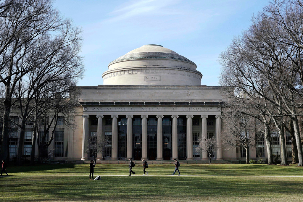 FILE - Students walk past the "Great Dome" atop Building 10 on the Massachusetts Institute of Technology campus in Cambridge, Mass., April 3, 2017. (AP Photo/Charles Krupa, File)