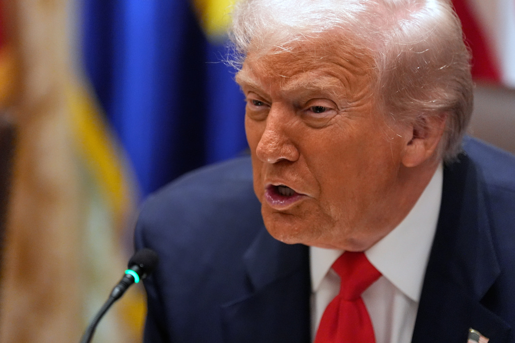 President Donald Trump speaks as he meets with Argentina's President Javier Milei in the Cabinet Room of the White House, Tuesday, Oct. 14, 2025, in Washington. (AP Photo/Alex Brandon)