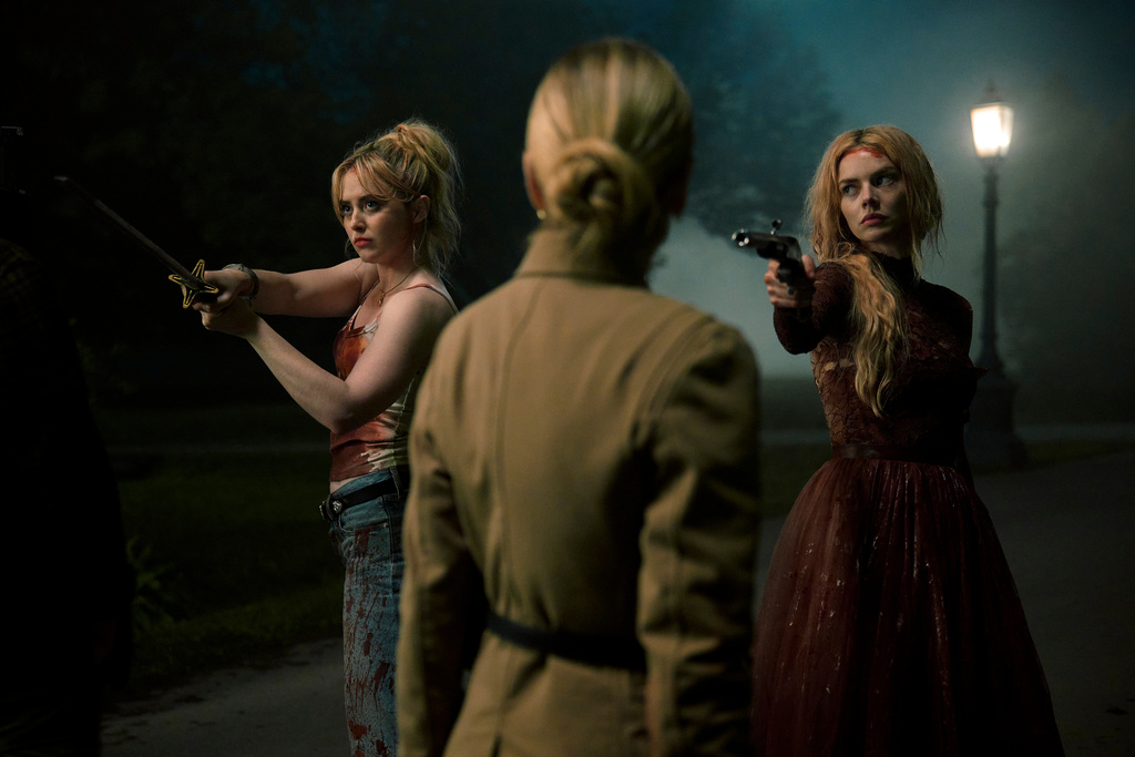 This image released by Searchlight Pictures shows Kathryn Newton, from left, Sarah Michelle Gellar, and Samara Weaving in a scene from "Ready or Not 2: Here I Come." (Pief Weyman/Searchlight Pictures via AP)