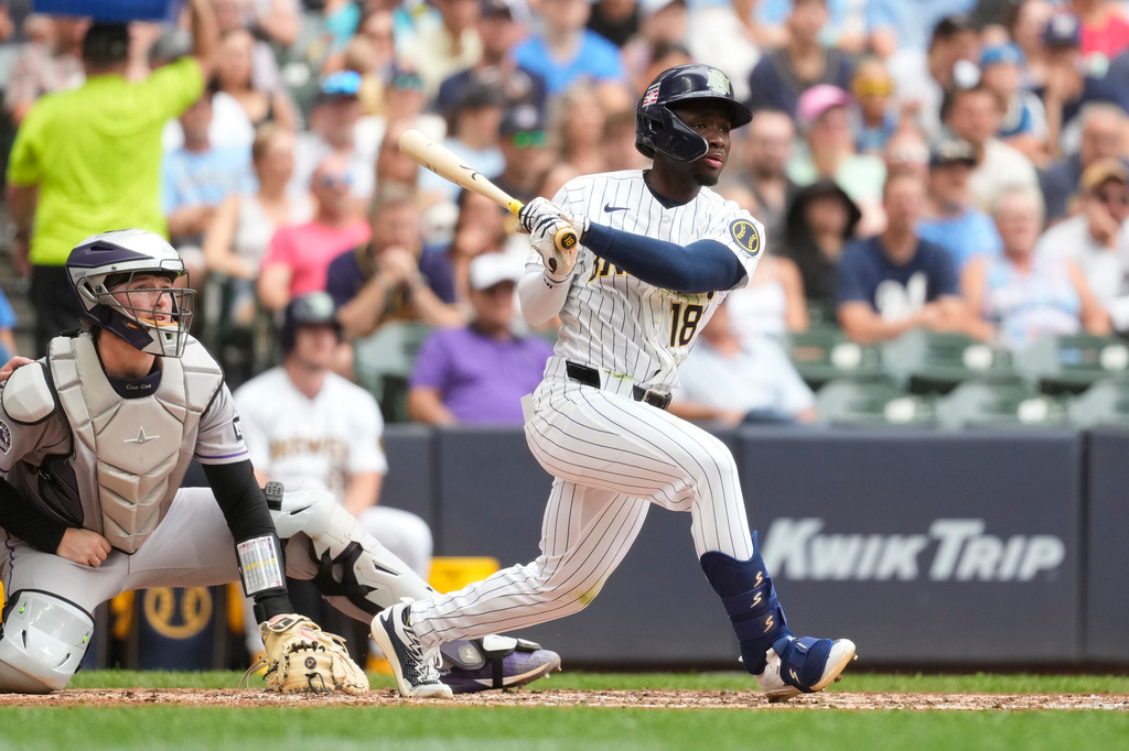 Milwaukee Brewers' Luis Lara hits an RBI double during the sixth inning of a baseball game against the Colorado Rockies, Sunday, July 26, 2026, in Milwaukee. (AP Photo/Aaron Gash)