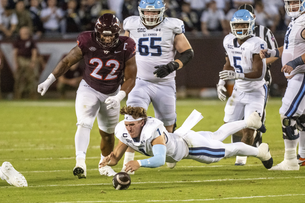 Old Dominion quarterback Colton Joseph (1) recovers a fumble against Virginia Tech during the first half of an NCAA college football game Saturday, Sept. 13, 2025, in Blacksburg, Va. (AP Photo/Robert Simmons)