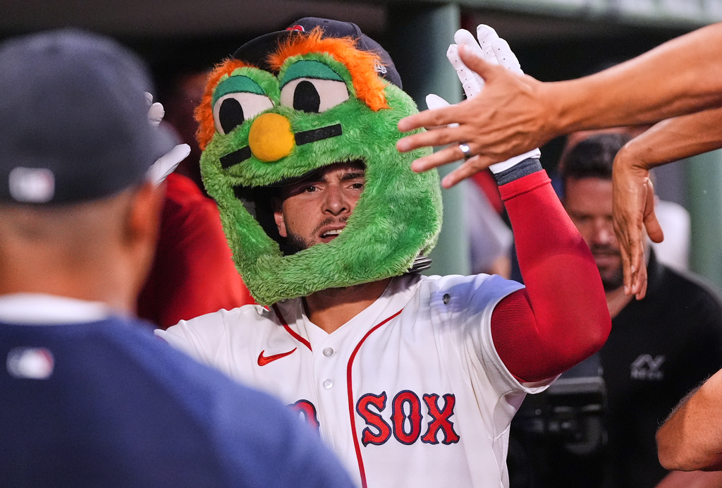 Boston Red Sox's Wilyer Abreu is congratulated after his solo home run during the third inning of a baseball game against the Chicago White Sox, Wednesday, Aug. 5, 2026, in Boston. (AP Photo/Charles Krupa)