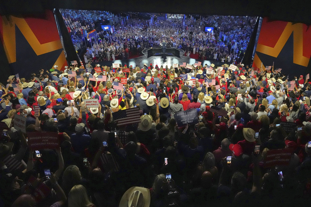 President Donald Trump, center rear, speaks in front of a large crowd at the Republican convention Wednesday, Sept. 9, 2026, in Dallas. (AP Photo/Julio Cortez)