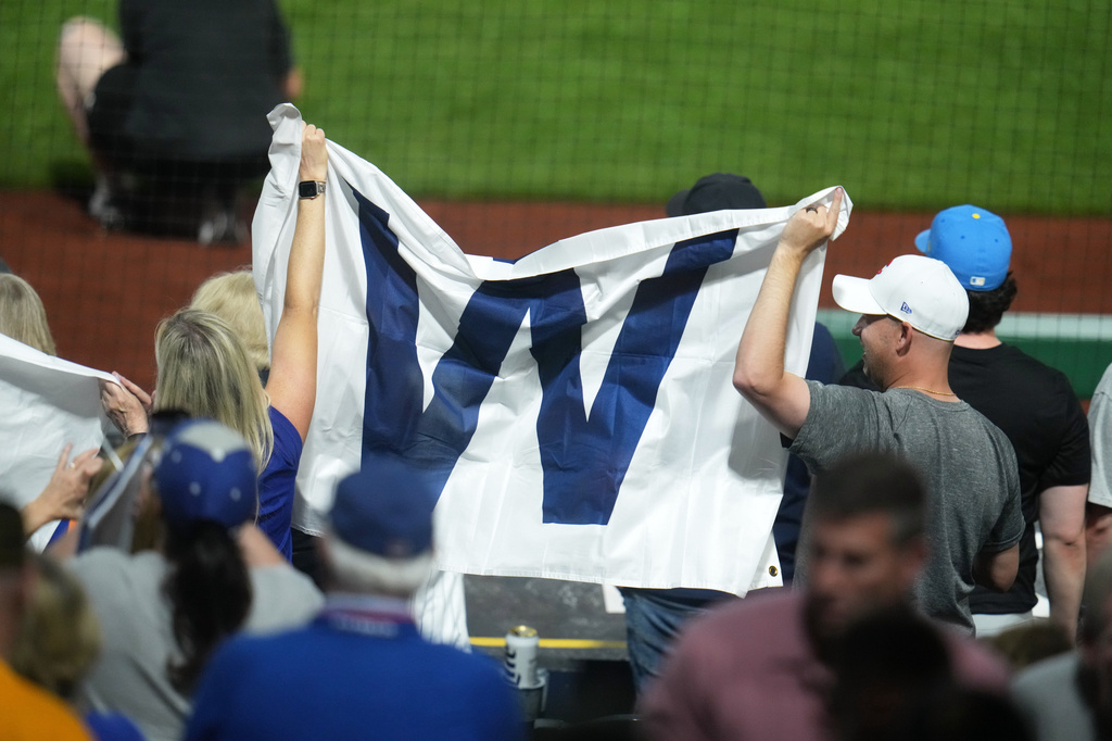 Chicago Cubs fans celebrate after the final out of a baseball game between the Pittsburgh Pirates and the Chicago Cubs in Pittsburgh, Wednesday, May 27, 2026. (AP Photo/Gene J. Puskar)