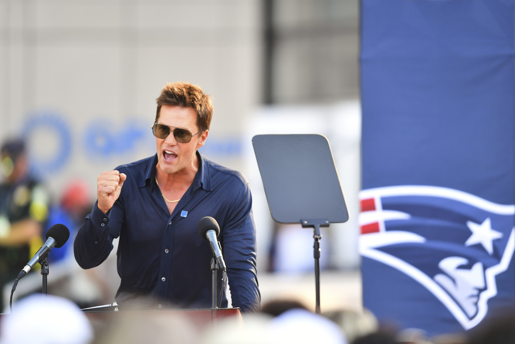 Former New England Patriots quarterback Tom Brady speaks after a bronze statue of himself was unveiled in Patriot Place Plaza before an NFL preseason football game between the Washington Commanders and the New England Patriots Friday, Aug. 8, 2025, in Foxborough, Mass. (AP Photo/Charles Krupa)