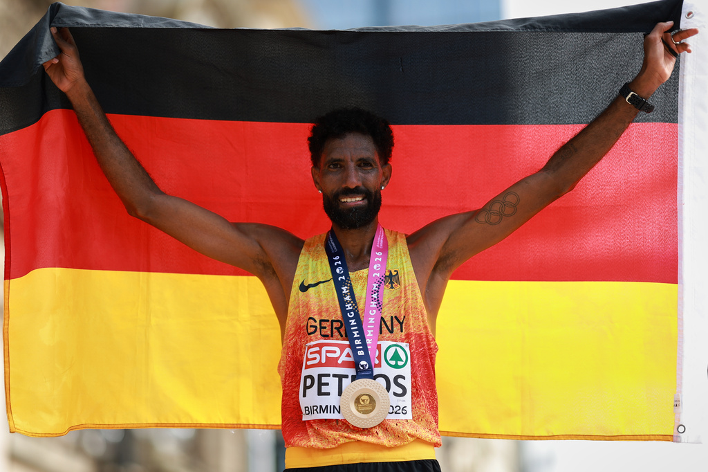 Amanal Petros of Germany celebrates winning the men's marathon at the European Athletics Championships in Birmingham, England, Sunday, Aug. 16, 2026. (AP Photo/Morgan Harlow)