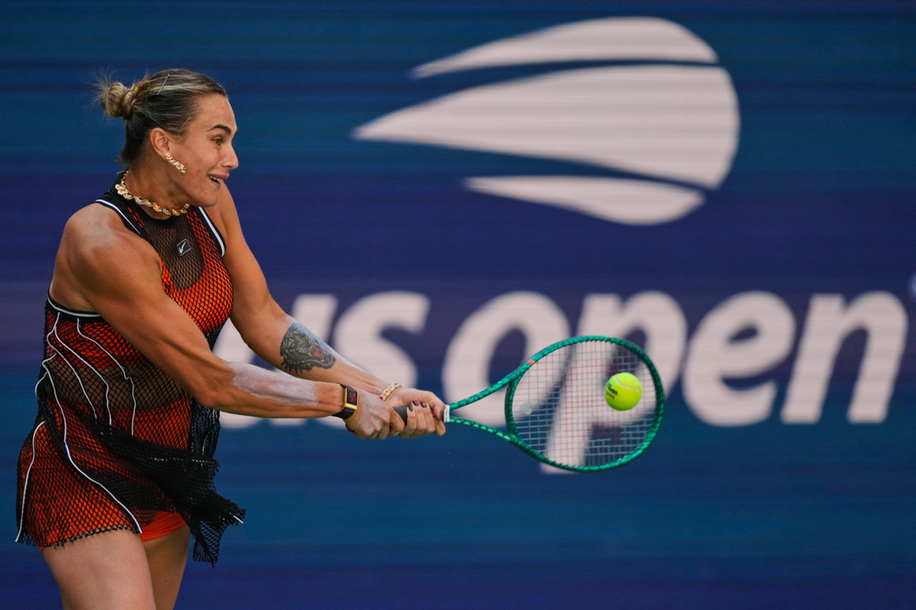Aryna Sabalenka, of Belarus, returns the ball during a mixed doubles match at the U.S. Open tennis championships, Tuesday, Aug. 25, 2026, in New York. (AP Photo/Yuki Iwamura)
