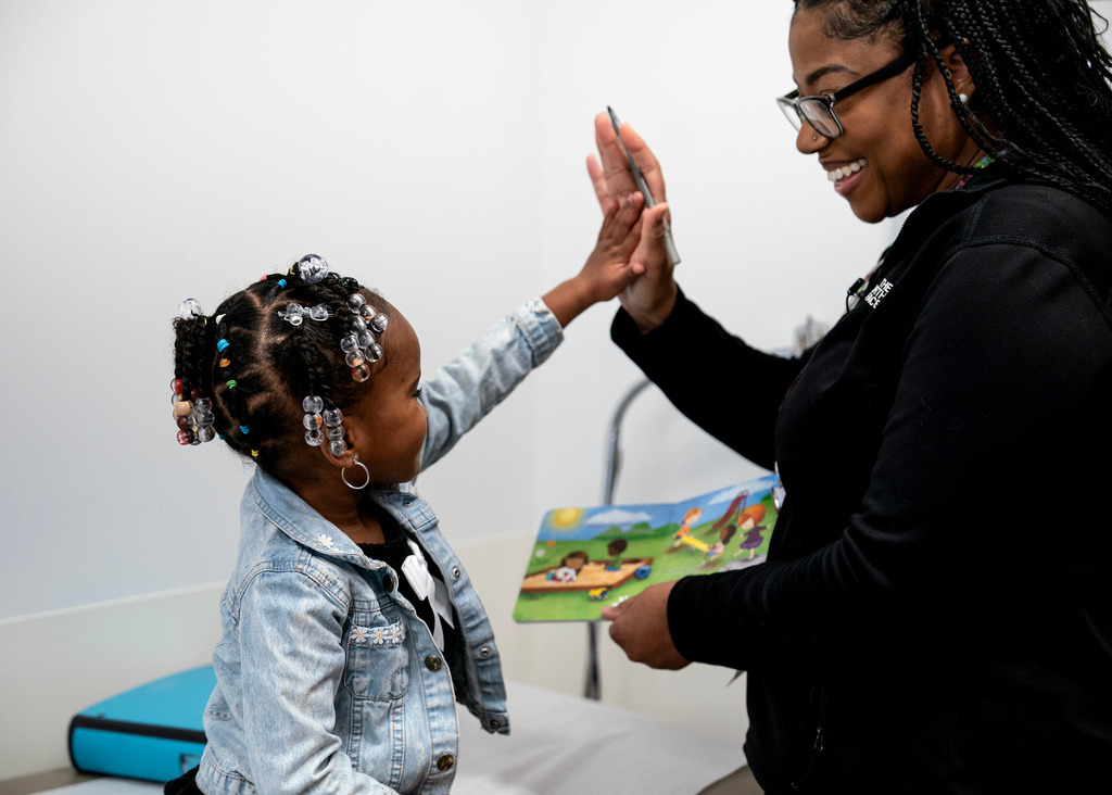 Juri Sleet, 4, works with Crystal Webb, a kindergarten readiness coordinator at Linden Primary Care Center at Nationwide Children's Hospital, Thursday, Dec. 11, 2025, in Columbus, Ohio. (AP Photo/Jessica Phelps)