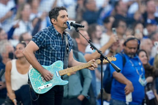 Recording artist Brad Paisley perform the national anthem prior to Game 3 of baseball's World Series between the Toronto Blue Jays and the Los Angeles Dodgers, Monday, Oct. 27, 2025, in Los Angeles. (AP Photo/Ashley Landis) Recording artist Brad Paisley perform the national anthem prior to Game 3 of baseball's World Series between the Toronto Blue Jays and the Los Angeles Dodgers, Monday, Oct. 27, 2025, in Los Angeles. (AP Photo/Ashley Landis)