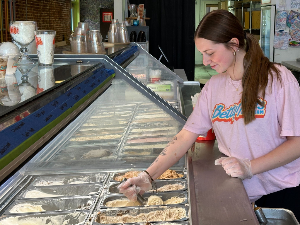 Riley Mustard, a scooper at Betty Rae's Ice Cream, puts an order together on Tuesday, April 28, 2026, in Kansas City, Mo., as the store prepares for the 2026 FIFA World Cup. (AP Photo/Nick Ingram)