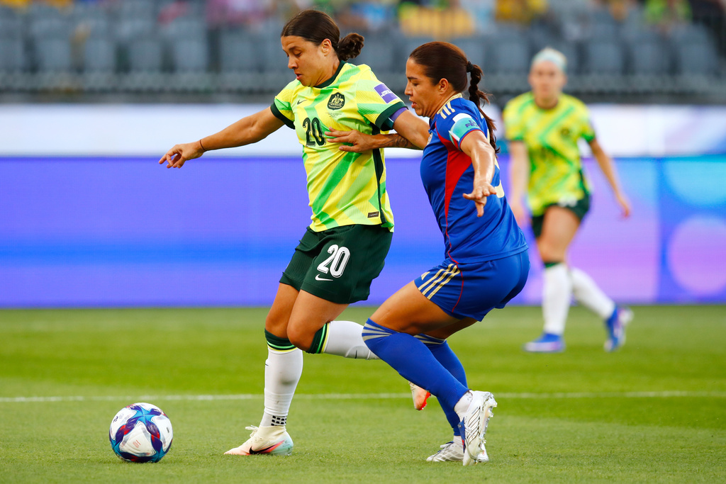 Australia's Sam Kerr, left, and Philippines' Hali Long battle for the ball during the Women's Asia Cup soccer match between Australia and the Philippines in Perth, Australia, Sunday, March 1, 2026. (AP Photo/Gary Day)