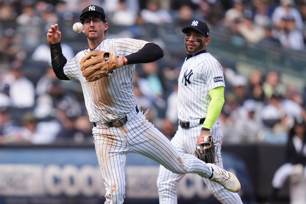 New York Yankees third baseman Ryan McMahon can't make the throw to first during the fourth inning of a baseball game against the Baltimore Orioles, Sunday, May 3, 2026, in New York. (AP Photo/Seth Wenig)