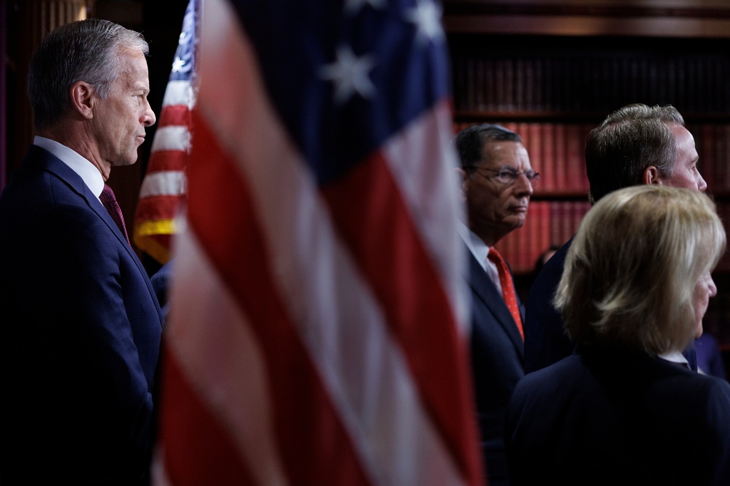 Senate Majority Leader John Thune R-S.D., looks on as fellow Republicans take questions from reporters during a news conference on Capitol Hill on Saturday, March 21, 2026, in Washington. (AP Photo/Tom Brenner)