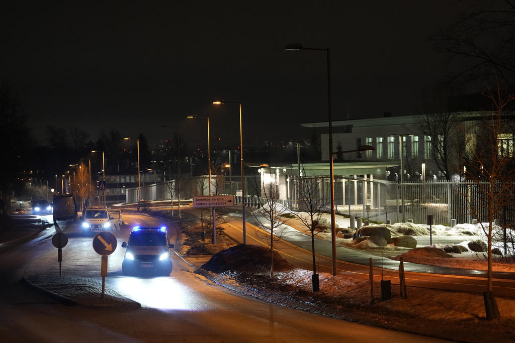Norwegian police attend outside the U.S. Embassy in Oslo, Norway in the early hours of Sunday, March 8, 2026. (Javad Parsa/NTB Scanpix via AP)