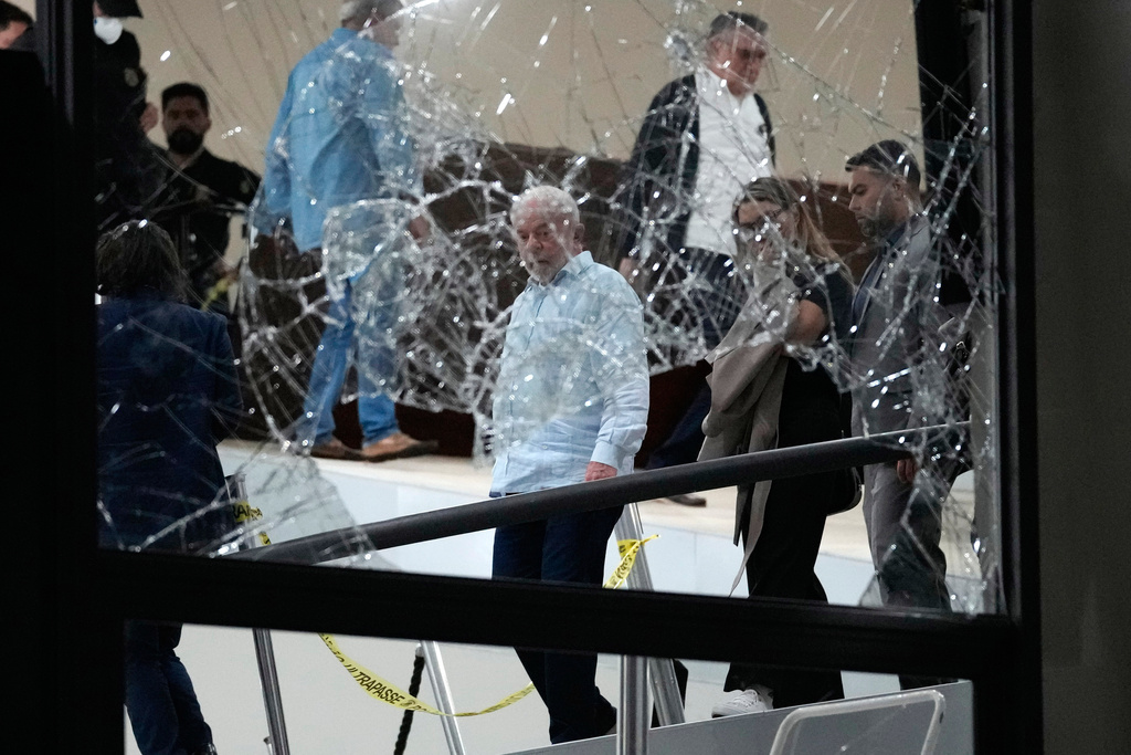 FILE - Brazil's President Luiz Inacio Lula da Silva surveys the damage at the Planalto Palace after it was stormed by supporters of former President Jair Bolsonaro, in Brasilia, Brazil, Jan. 8, 2023. (AP Photo/Eraldo Peres, File)