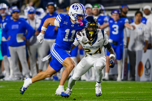 BYU wide receiver Parker Kingston (11) runs the football in for a touchdown after making a catch during the first half of an NCAA college football game against West Virginia, Friday, Oct. 3, 2025, in Provo, Utah. (AP Photo/Tyler Tate) BYU wide receiver Parker Kingston (11) runs the football in for a touchdown after making a catch during the first half of an NCAA college football game against West Virginia, Friday, Oct. 3, 2025, in Provo, Utah. (AP Photo/Tyler Tate)