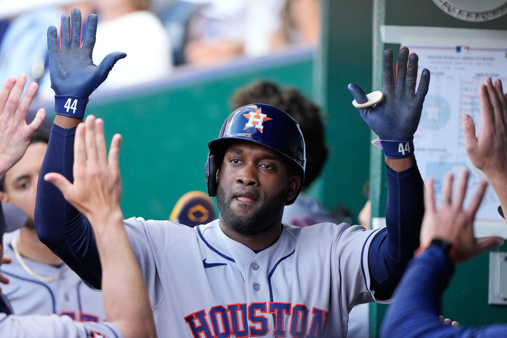 Houston Astros' Yordan Alvarez celebrates in the dugout after hitting a two-run home run hit during the first inning of a baseball game against the Kansas City Royals, Friday, June 12, 2026, in Kansas City, Mo. (AP Photo/Charlie Riedel)