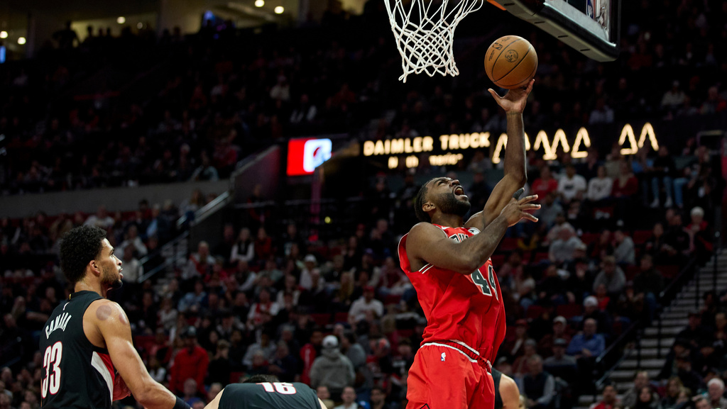 Chicago Bulls forward Patrick Williams, right, shoots over Portland Trail Blazers forward Toumani Camara during the second half of an NBA basketball game in Portland, Ore., Wednesday, Nov. 19, 2025. (AP Photo/Craig Mitchelldyer)
