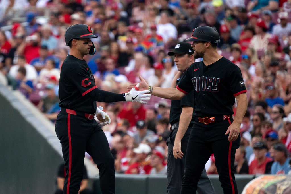 Cincinnati Reds' Spencer Steer reacts after hitting a single in the first inning of a baseball game against the Chicago Cubs, Friday, July 10, 2026, in Cincinnati. (AP Photo/Michael Swensen)