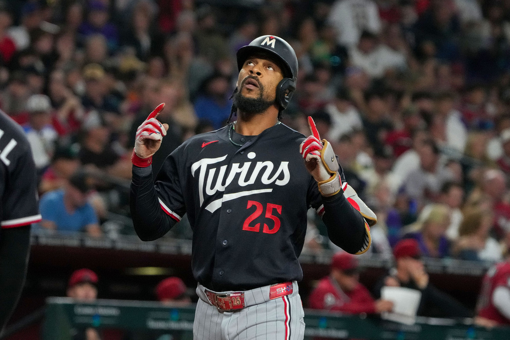 Minnesota Twins center fielder Byron Buxton looks skyward after hitting a grand slam against the Arizona Diamondbacks in the fifth inning of a baseball game Saturday, June 20, 2026, in Phoenix. (AP Photo/Darryl Webb)