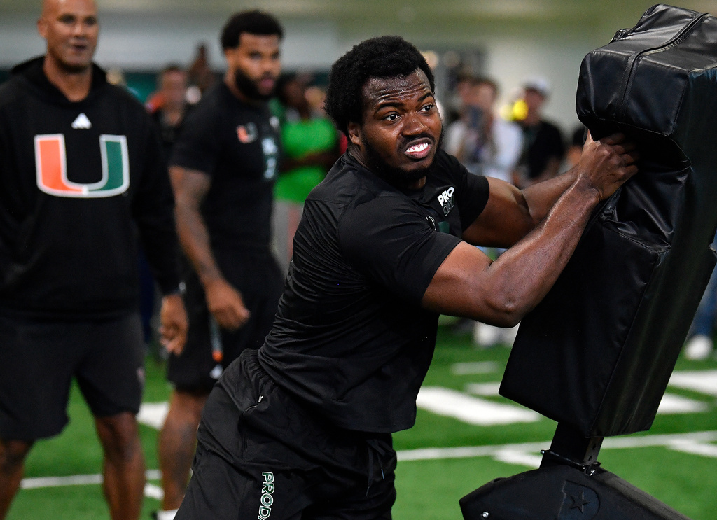 Miami defensive lineman Rueben Bain Jr. does a football workout during the school's NFL pro day, Monday March 23, 2026, in Coral Gables, Fla. (AP Photo/Michael Laughlin)