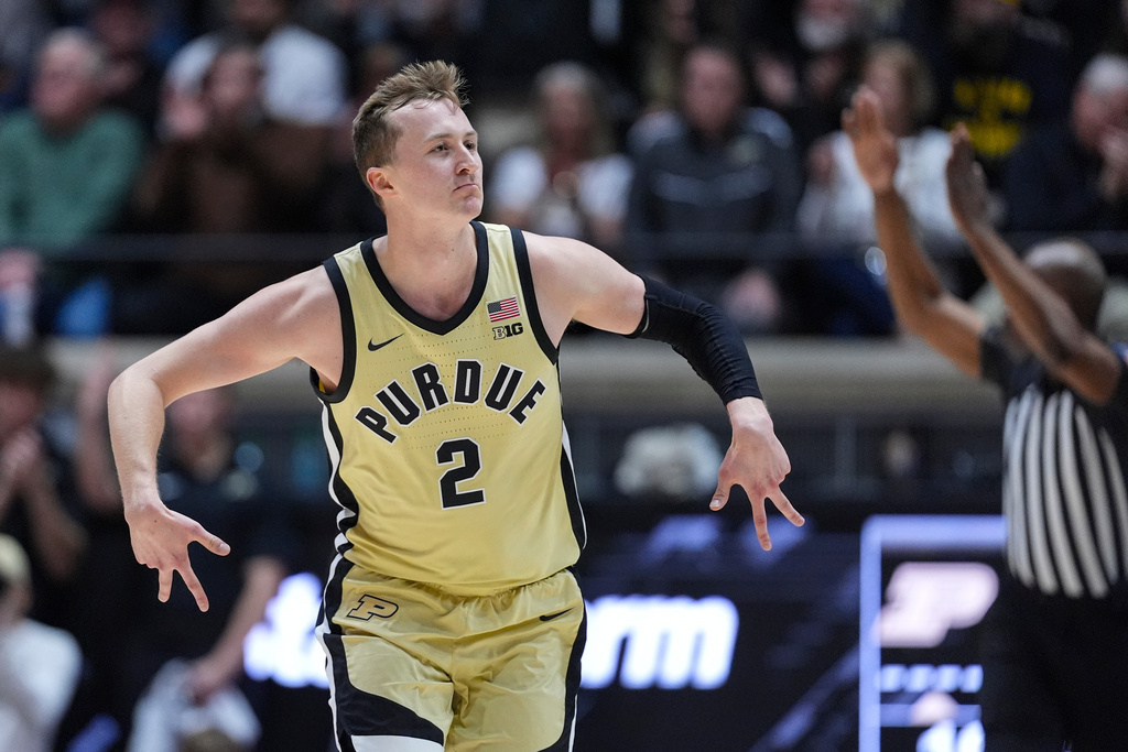 Purdue guard Fletcher Loyer (2) celebrates after a basket against Michigan during the first half of an NCAA college basketball game in West Lafayette, Ind., Tuesday, Feb. 17, 2026. (AP Photo/Michael Conroy)