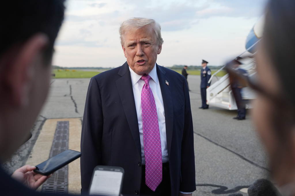President Donald Trump speaks with reporters before boarding Air Force One at Morristown Airport, Sunday, Sept. 14, 2025, in Morristown, N.J. (AP Photo/Alex Brandon)